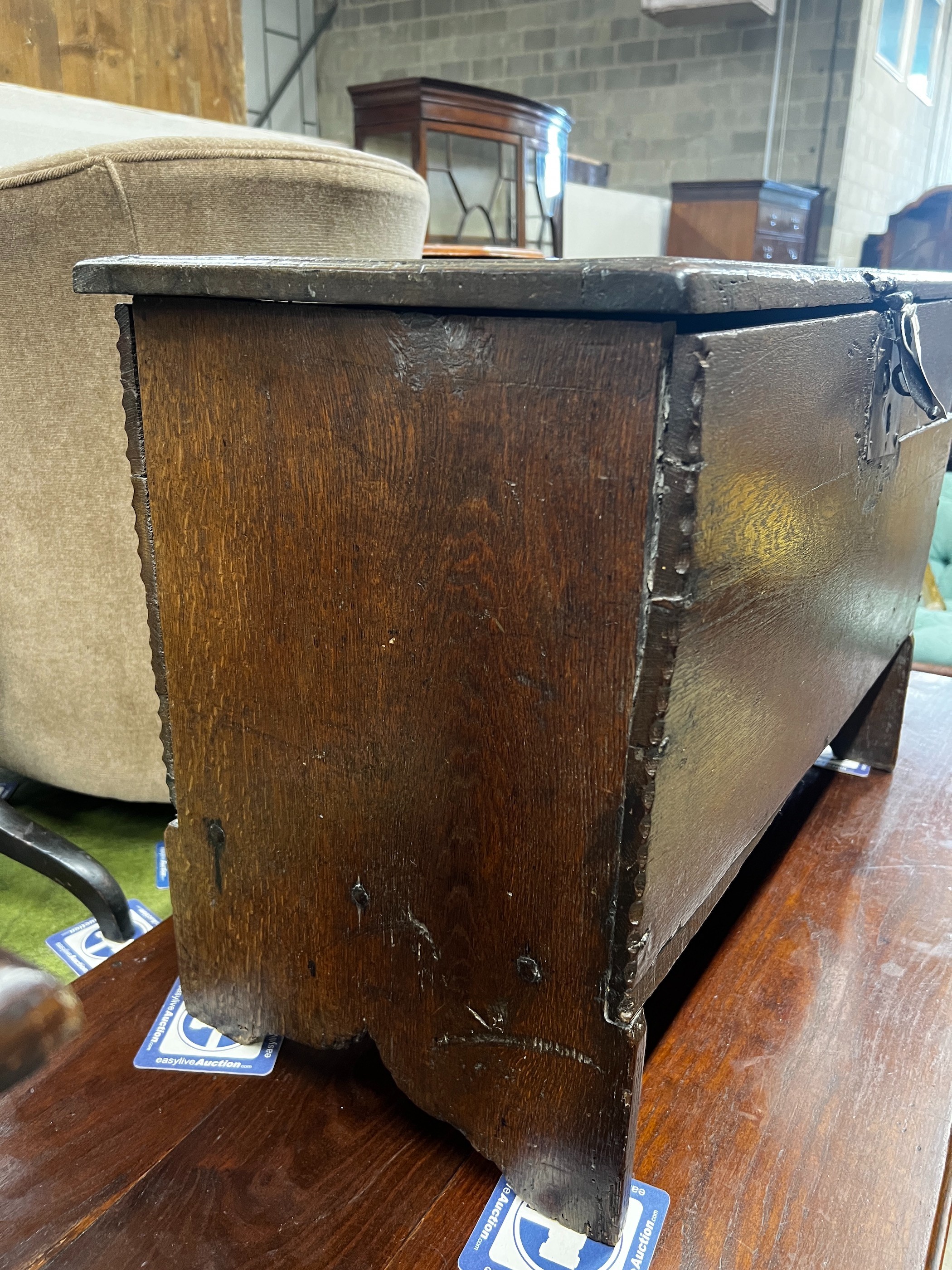 A late 17th century oak six plank coffer, length 73cm, depth 35cm, height 50cm